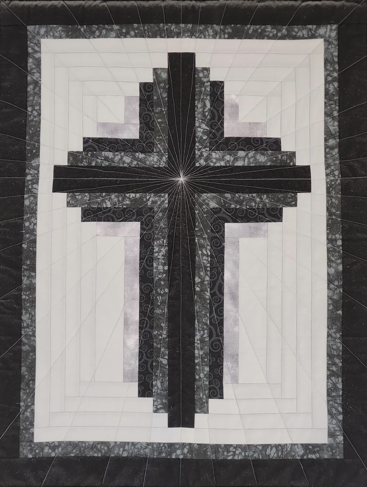 Cross quilt made by our quilters